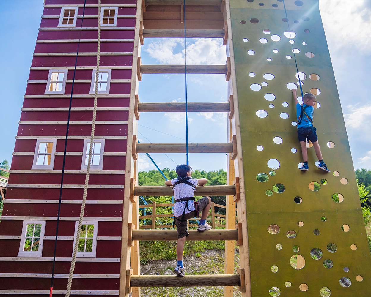 Children on the climbing wall at hangloose adventure eden