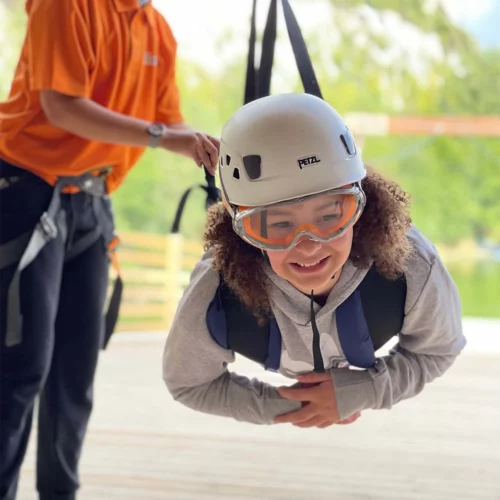 School girl about to zipline down the skywire
