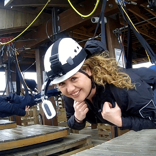 Close up image of a women ready to zipwire down the hangloose skywire